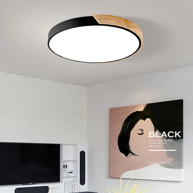 Plafonnier LED macaron noir – ambiance salon télévision