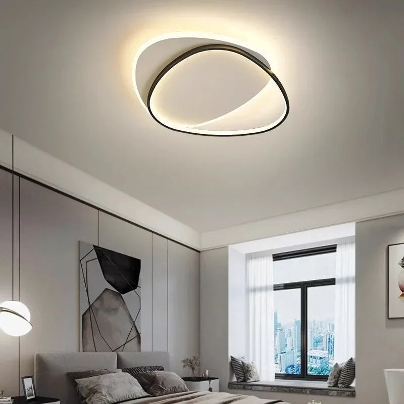 Plafonnier LED ovale moderne Noir – ambiance chambre contemporaine